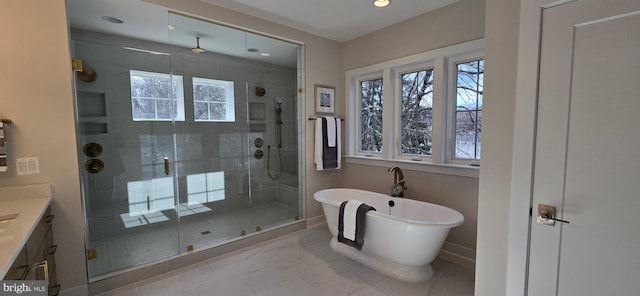 bathroom featuring vanity and separate shower and tub