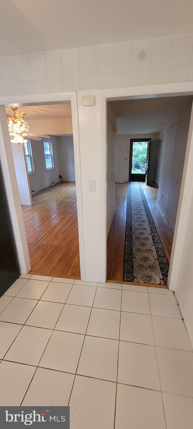 hall with hardwood / wood-style floors