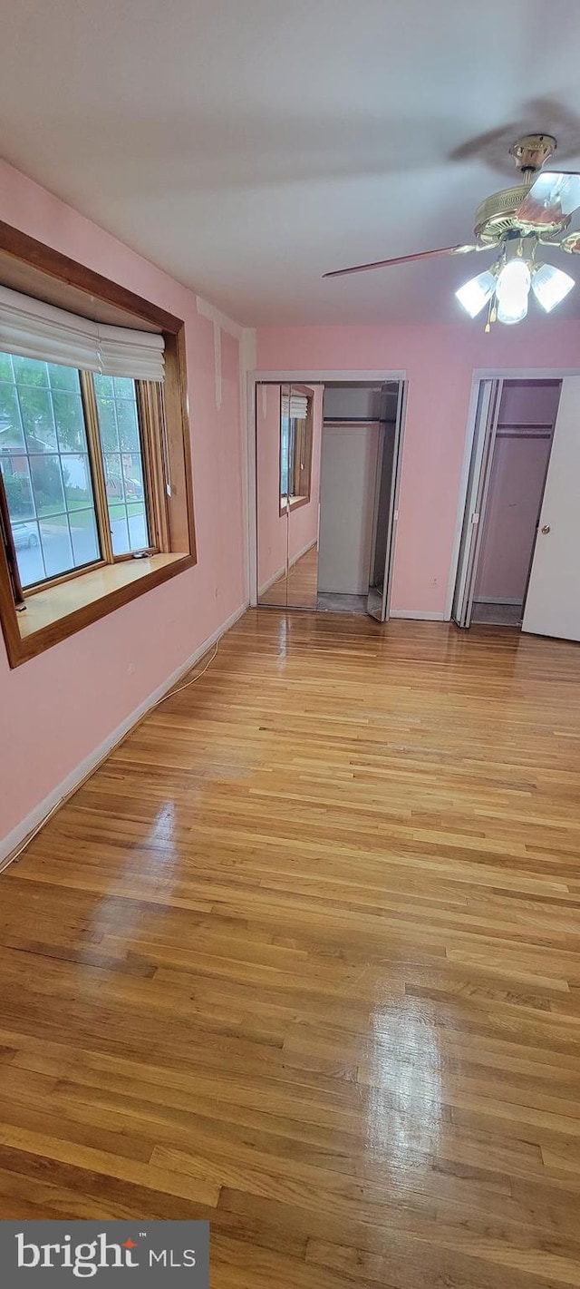 interior space featuring light hardwood / wood-style floors and ceiling fan