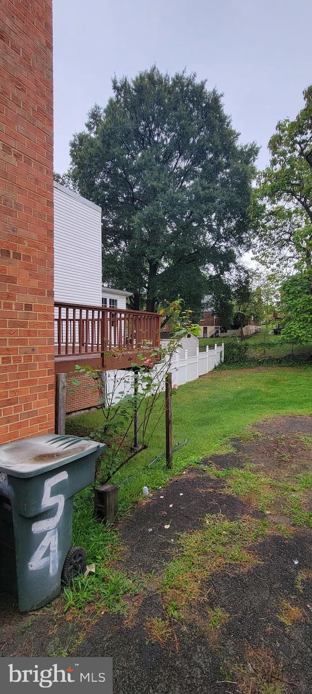 view of yard featuring a wooden deck