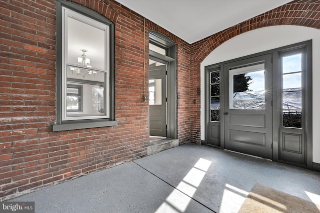 view of exterior entry with a porch