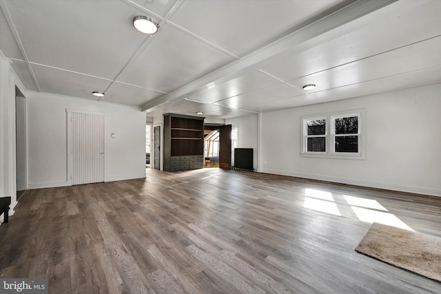 unfurnished living room with hardwood / wood-style flooring