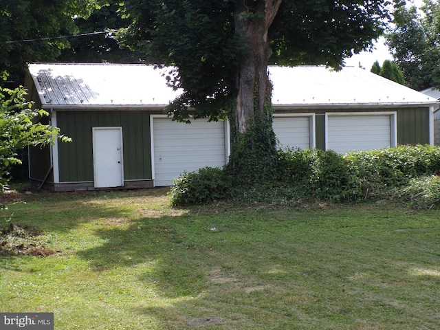 exterior space featuring an outbuilding and a garage