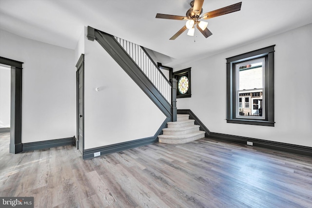 interior space with light hardwood / wood-style floors and ceiling fan