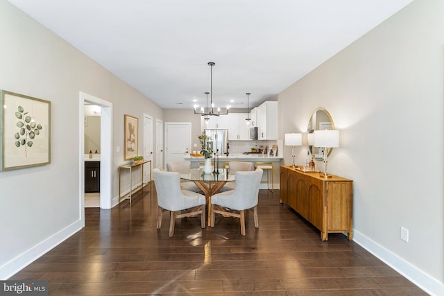dining room featuring recessed lighting, baseboards, an inviting chandelier, and dark wood-style floors