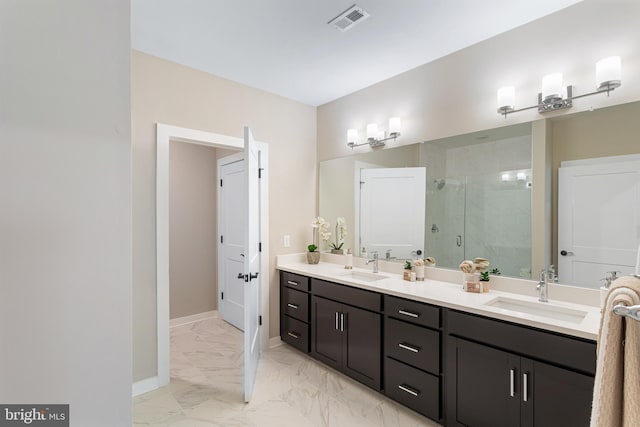 bathroom featuring an enclosed shower and vanity