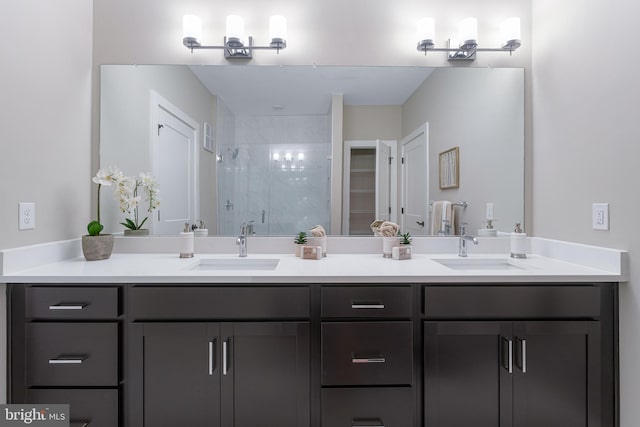 bathroom with vanity and a shower with shower door