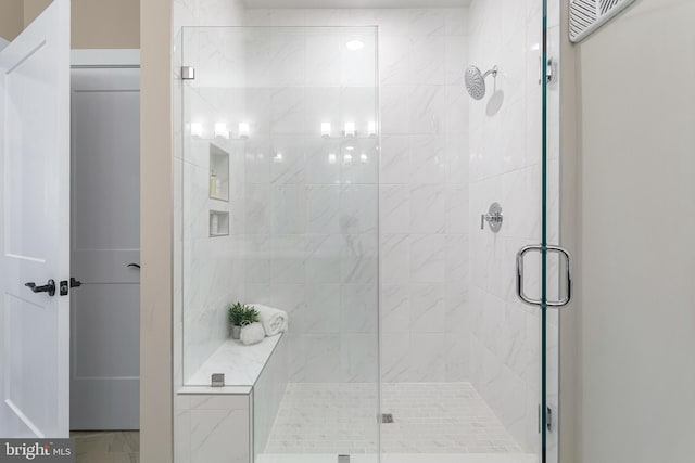 full bathroom featuring a shower stall