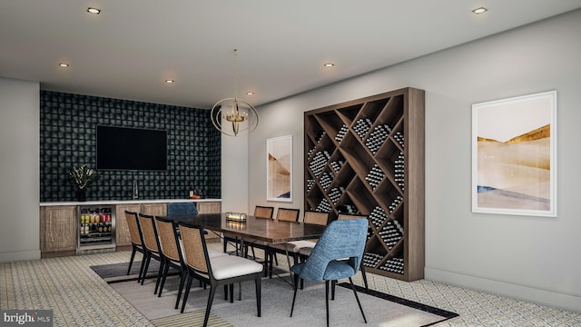 dining room featuring recessed lighting, beverage cooler, light carpet, baseboards, and a notable chandelier