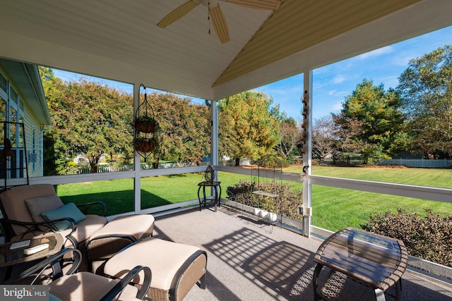 sunroom / solarium featuring ceiling fan and vaulted ceiling