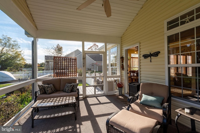 sunroom featuring lofted ceiling