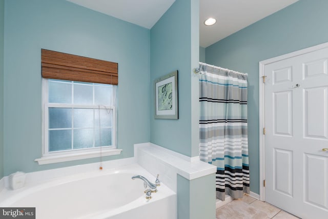 bathroom with plus walk in shower and tile patterned flooring