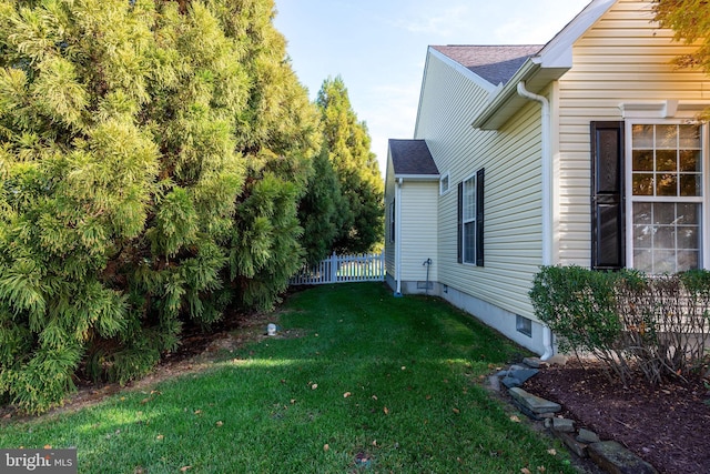 view of property exterior with a yard