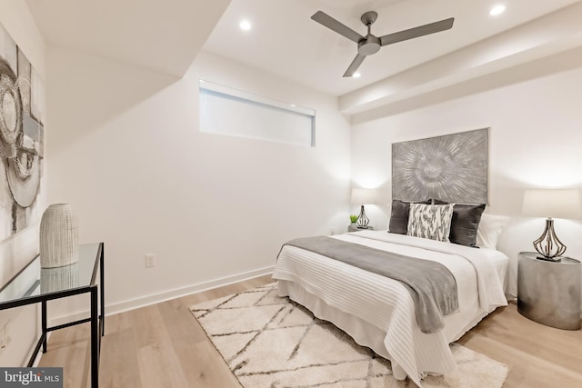 bedroom featuring light hardwood / wood-style flooring and ceiling fan