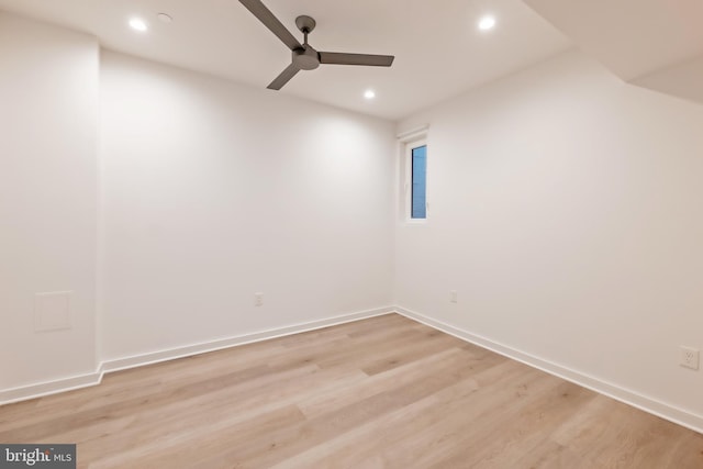 empty room with light hardwood / wood-style flooring and ceiling fan