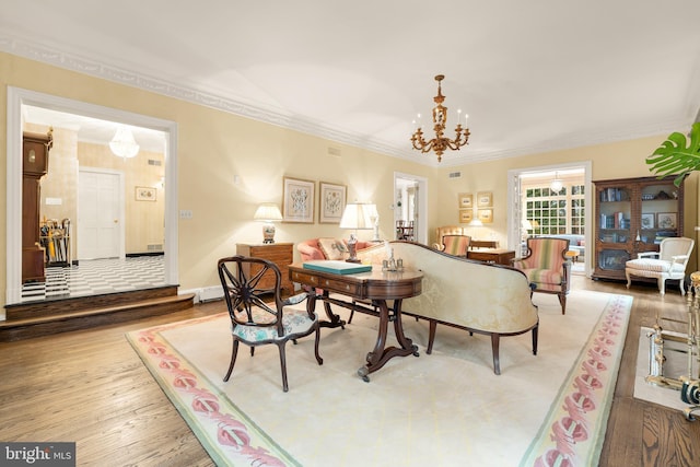 interior space with hardwood / wood-style flooring, ornamental molding, a chandelier, and a baseboard radiator