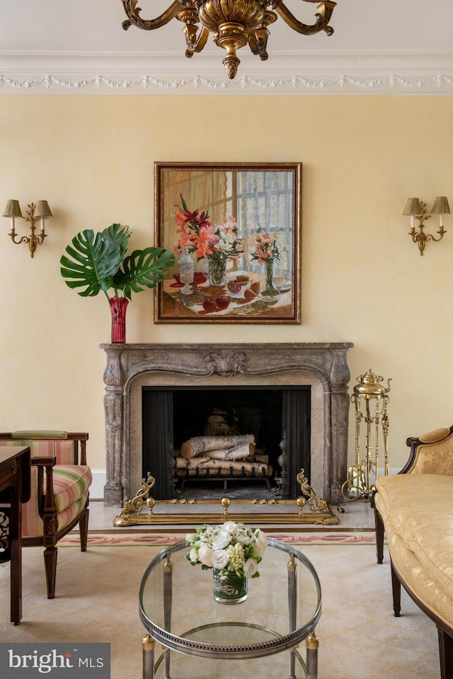 sitting room featuring ornamental molding and light colored carpet