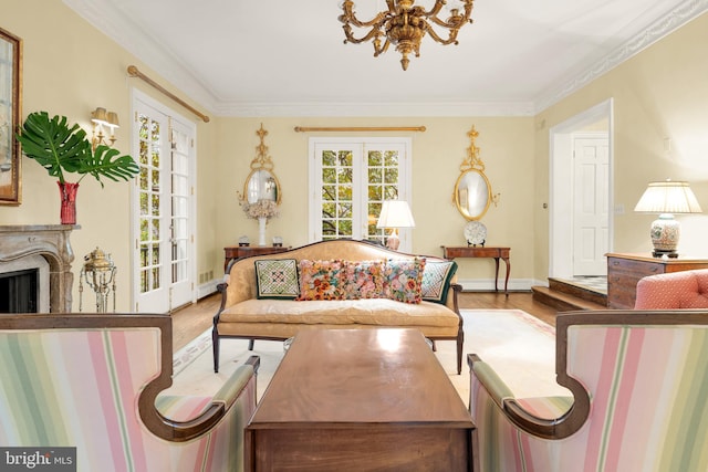 living area featuring hardwood / wood-style floors, crown molding, a high end fireplace, and french doors