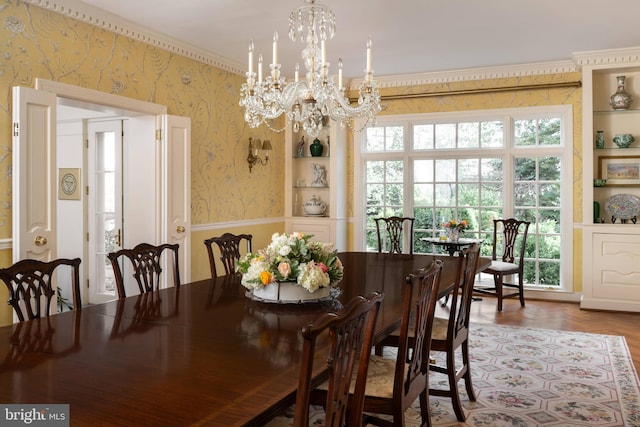 dining room with parquet floors and an inviting chandelier