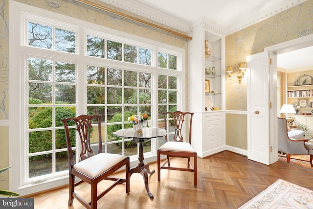 dining room featuring parquet flooring and built in features