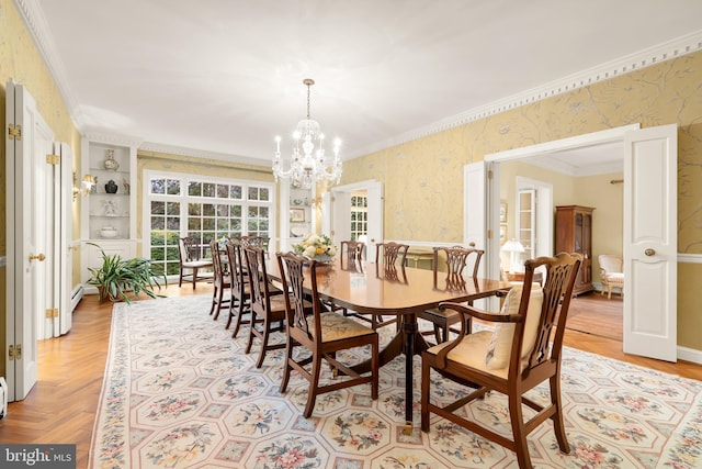 dining area featuring an inviting chandelier, ornamental molding, and light parquet flooring