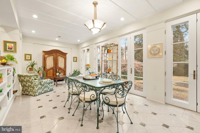 dining room featuring french doors and a healthy amount of sunlight