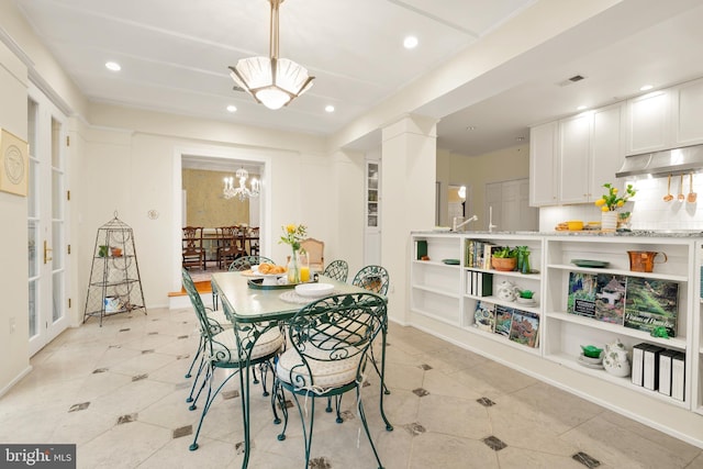 dining area with a chandelier