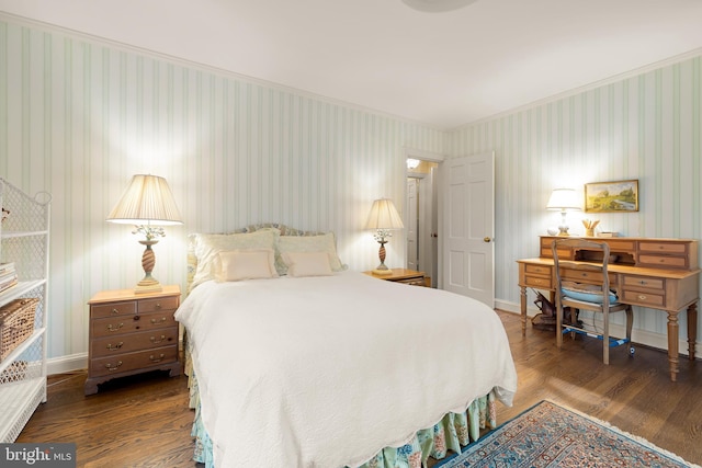 bedroom with dark hardwood / wood-style flooring