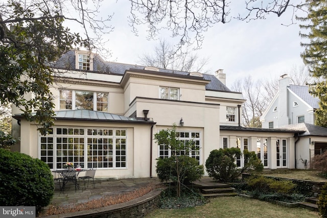 rear view of property with a patio area