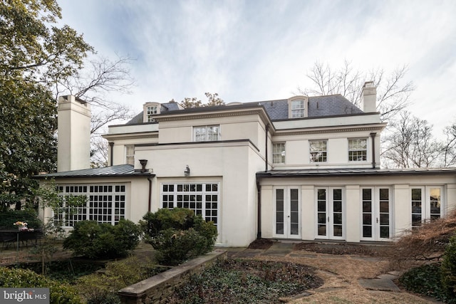 back of property featuring a garage