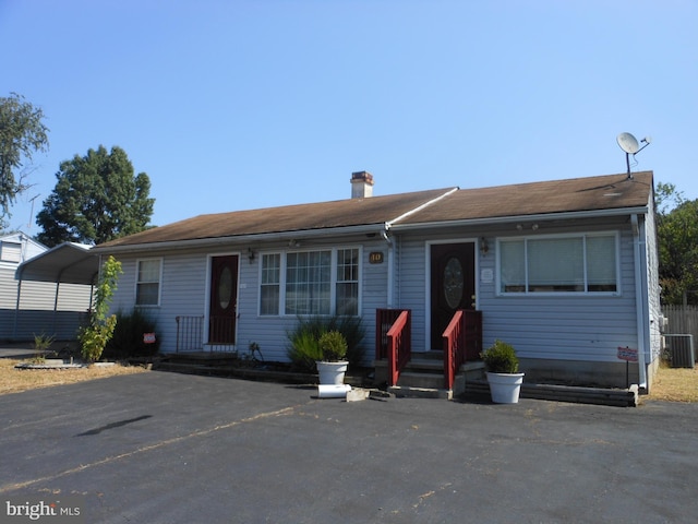 single story home featuring cooling unit