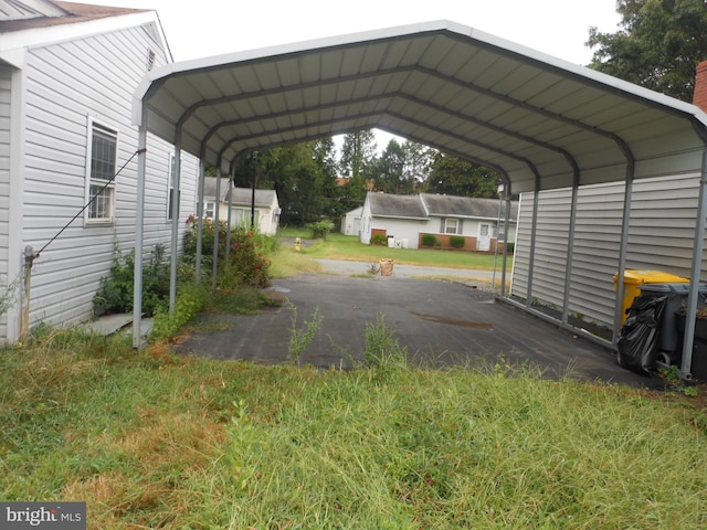 view of vehicle parking with a carport