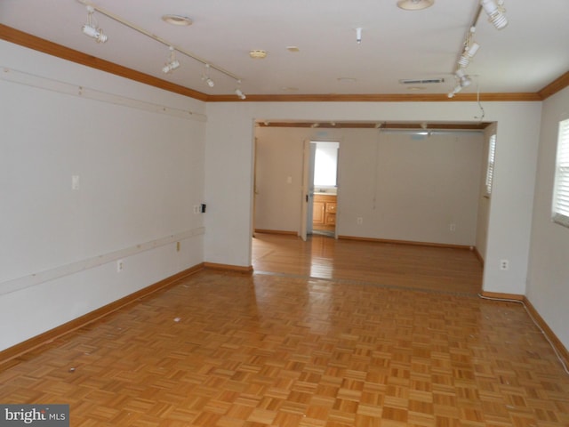 unfurnished room featuring light parquet flooring and crown molding