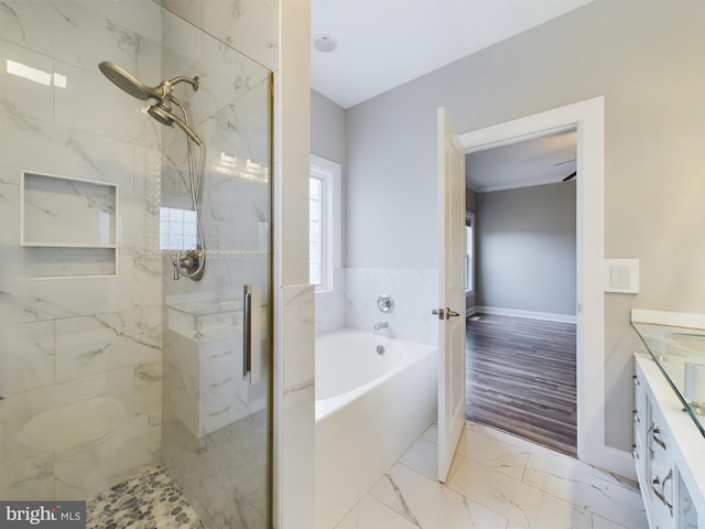 bathroom with vanity, separate shower and tub, and hardwood / wood-style flooring