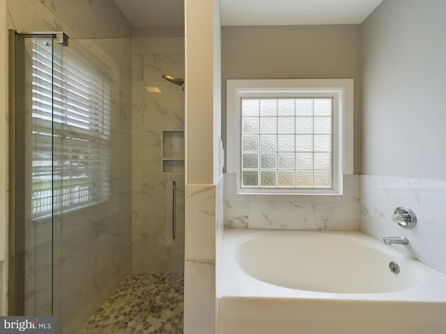 bathroom with independent shower and bath