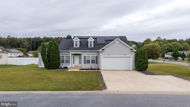 view of front of house featuring a garage and a front yard