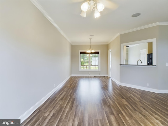 unfurnished living room featuring sink, ceiling fan with notable chandelier, crown molding, and dark hardwood / wood-style flooring