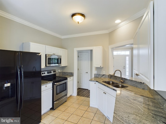 kitchen featuring appliances with stainless steel finishes, crown molding, sink, and white cabinets