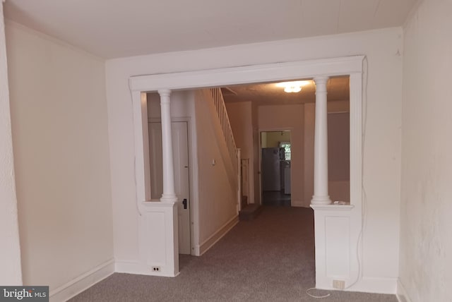 hallway with baseboards, carpet floors, stairway, and crown molding