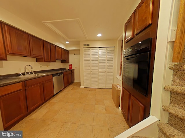 kitchen featuring sink, light tile patterned floors, stainless steel dishwasher, and oven