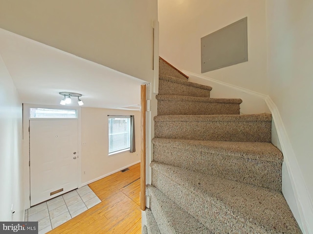 staircase featuring hardwood / wood-style floors