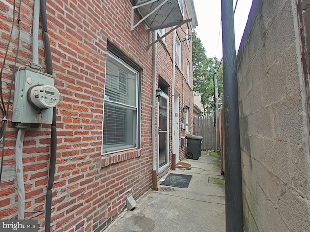 view of side of property featuring a patio area