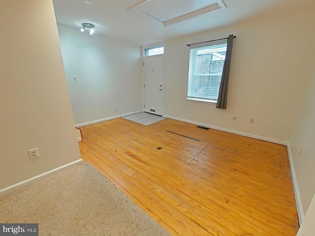 entrance foyer with hardwood / wood-style floors