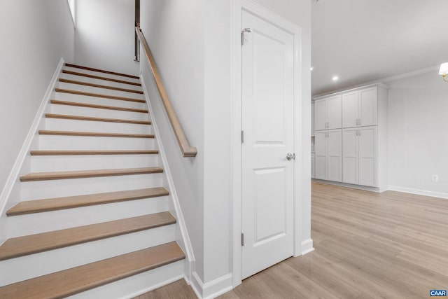 staircase with wood-type flooring