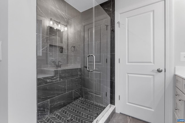 bathroom with vanity, tile patterned flooring, and an enclosed shower