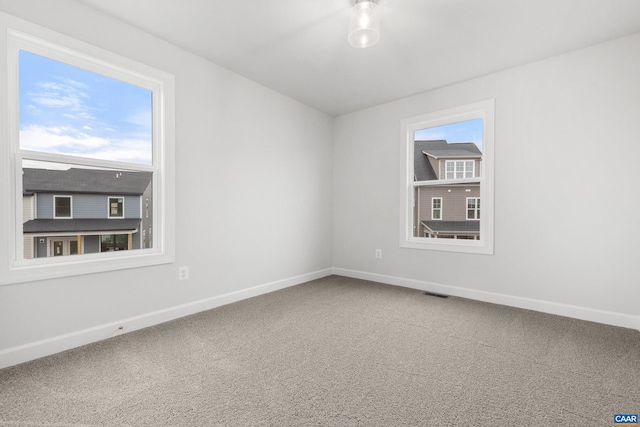 unfurnished room featuring carpet flooring