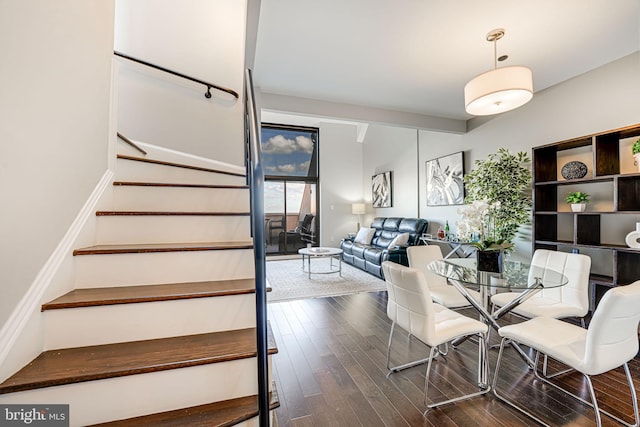 dining space with dark hardwood / wood-style floors