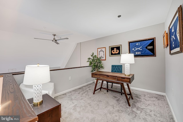 carpeted office featuring lofted ceiling and ceiling fan