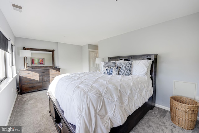 bedroom featuring light colored carpet