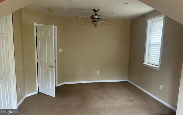 interior space featuring ceiling fan and carpet floors